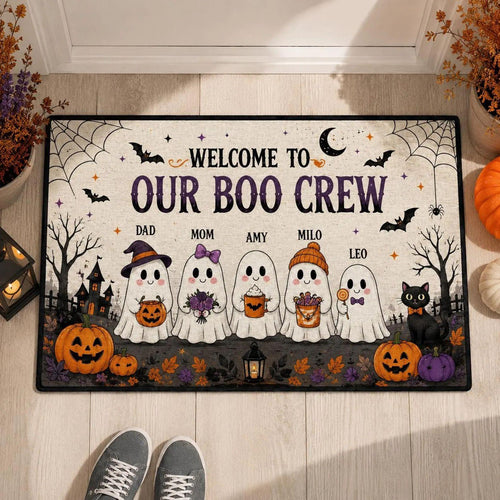 Boo Crew ghost family doormat on a front step