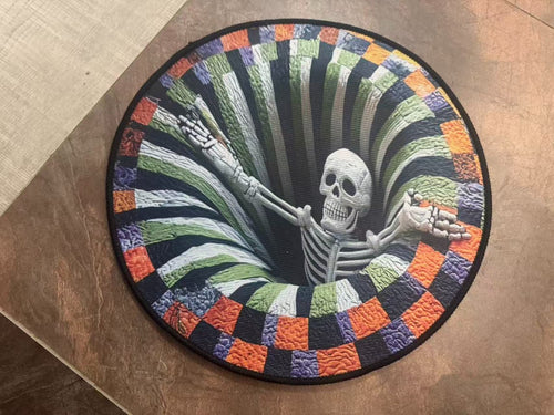 Round Halloween mat on a wooden floor